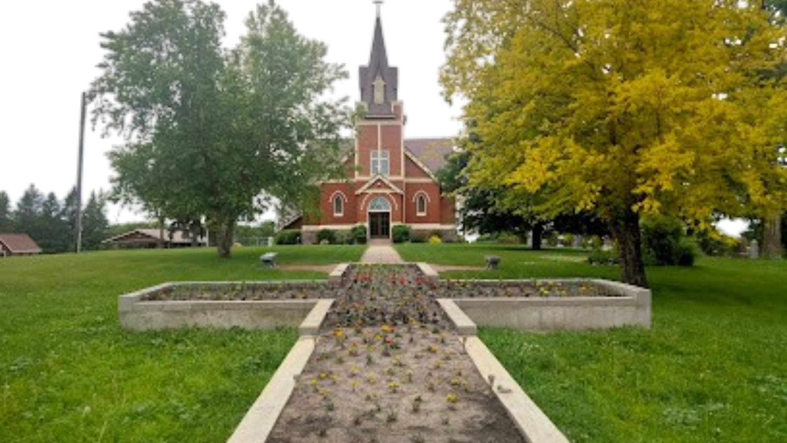 Picture of the church and cross flower bed
